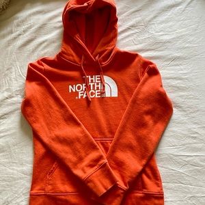 Orange North Face sweatshirt